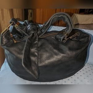 Badgley Mischka black leather with bow hobo bag.